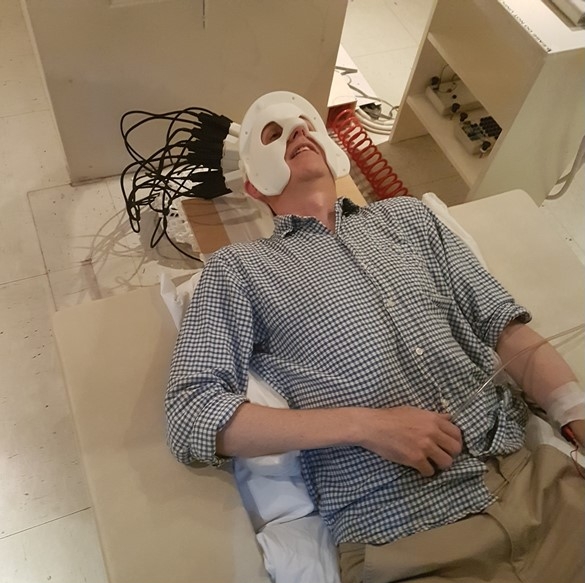 Prof. Gareth Barnes at UCL wearing a MEG scanner-cast with 13 OPMs over somatosensory cortex