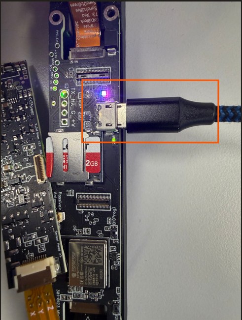 Magpie sled with shell removed showing the micro-USB connector highlighted in orange