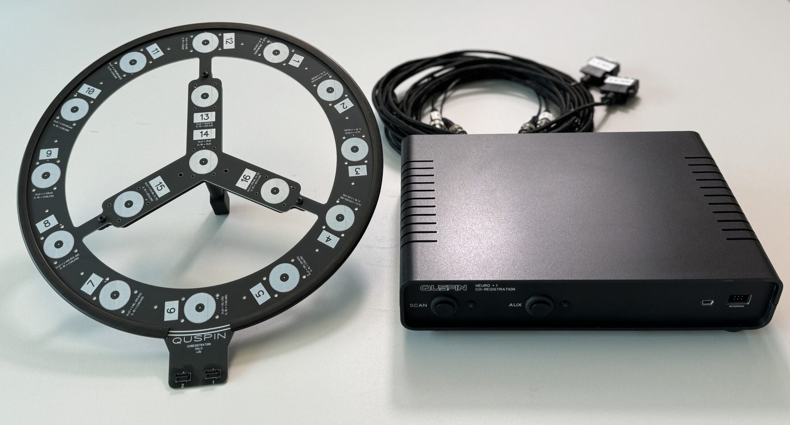 The HALO co-registration ring with 16 labeled coils, beside its controller and cables