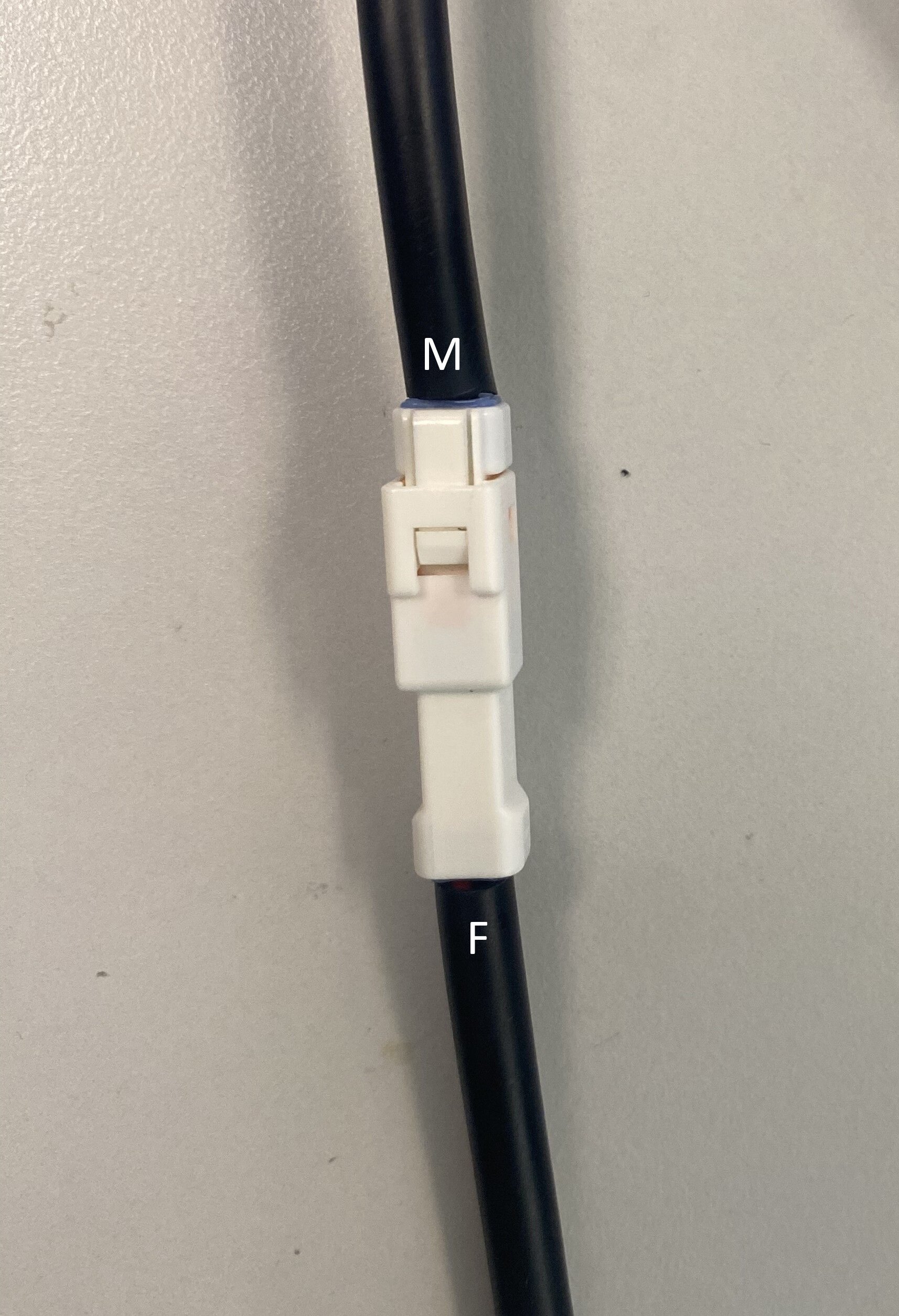 Magpie connected to battery, showing the male (M) and female (F) connector ends