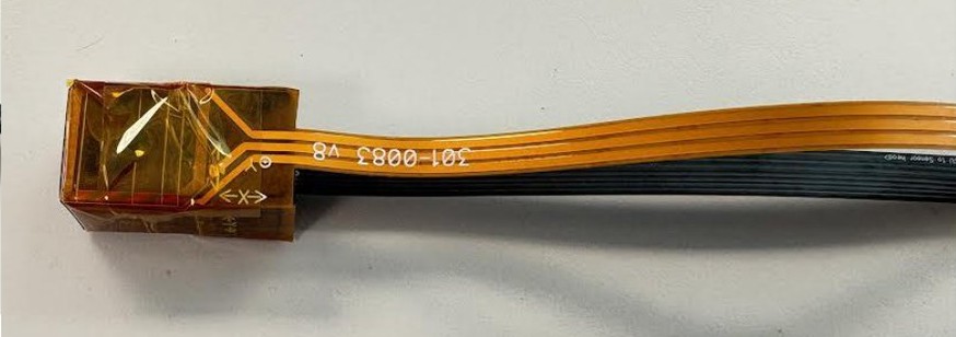 Folded coil edge secured with Kapton tape